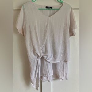 The brand is a.n.a a new approach, and the size is Medium.